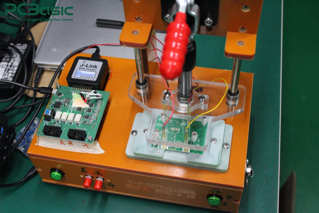 PCBA test fixture with J-Link programmer