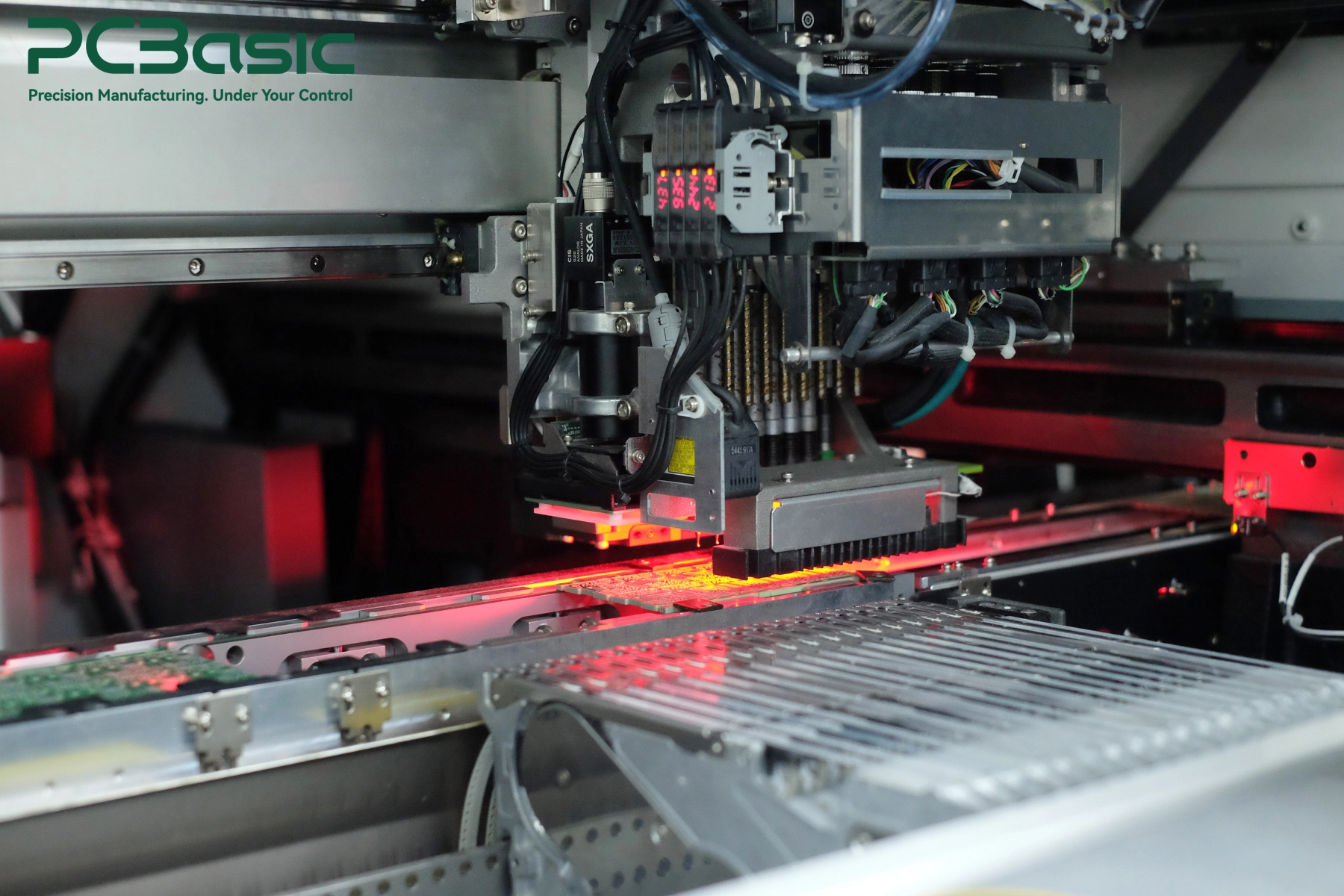 SMT placement machine assembling a PCB SMT placement machine assembling a PCB