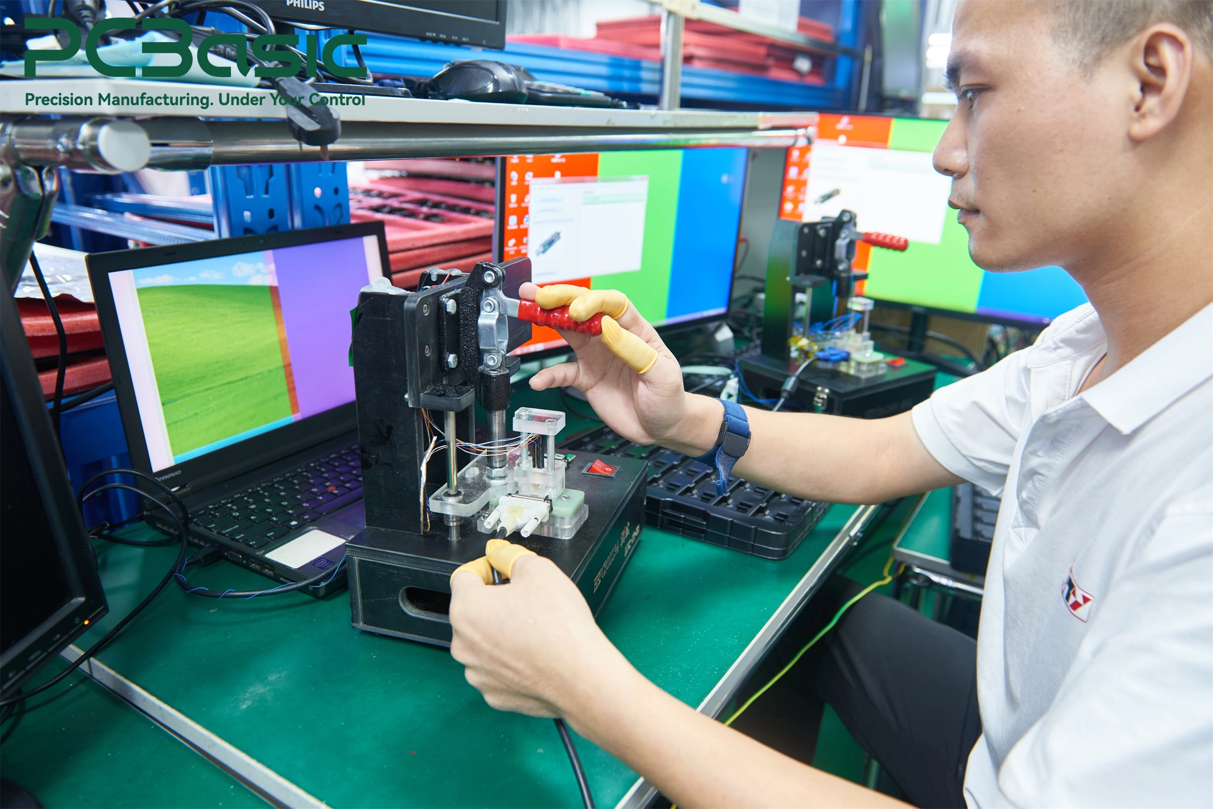 Technician performing PCBA functional testing